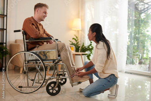 Woman Helping Husband with Disability