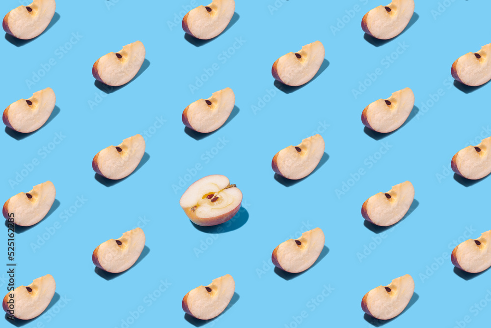Apple slices on a blue background Apple slices on a blue background