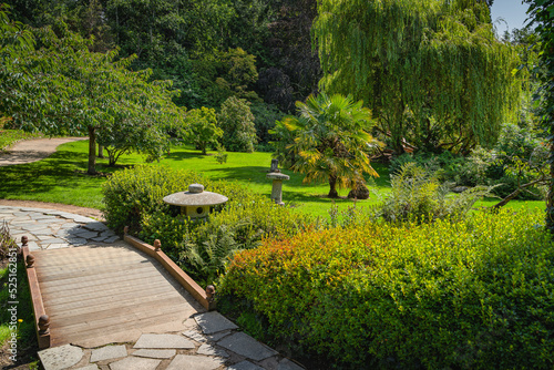Japanese style garden with footpaths, small wooden bridges and lush green vegetation in Powerscourt gardens, Enniskerry, Wicklow, Ireland