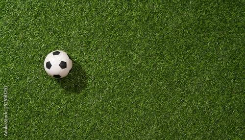 Soccer ball on green grass soccer field.