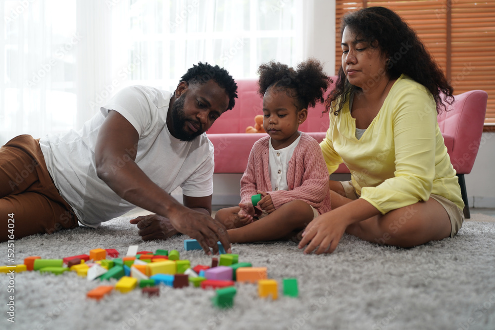 Shot of happy interracial family of mother father and their daughter inside modern apartment. Shot of happy interracial family of mother father and their daughter inside modern apartment.