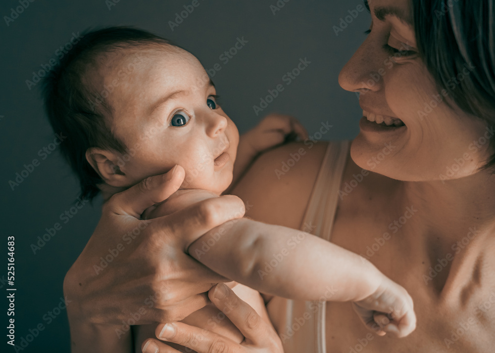 Mom, mummy, young mother with little baby daughter. Mum kissing and hugging child. Newborn cute happy girl smiling in woman hands. Happiness for parents in family. Aged parents, parenting, motherhood Mom, mummy, young mother with little baby daughter. Mum kissing and hugging child. Newborn cute happy girl smiling in woman hands. Happiness for parents in family. Aged parents, parenting, motherhood
