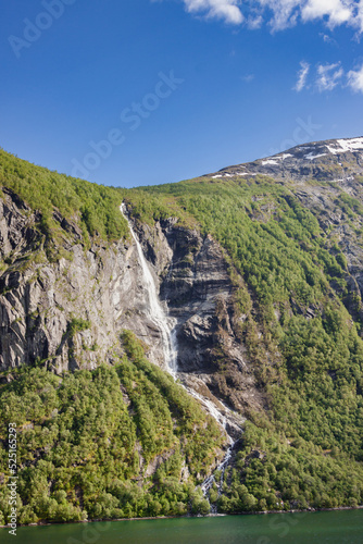 Beautiful and imposing Norwegian fjord in spring with its waterfalls © JPchret