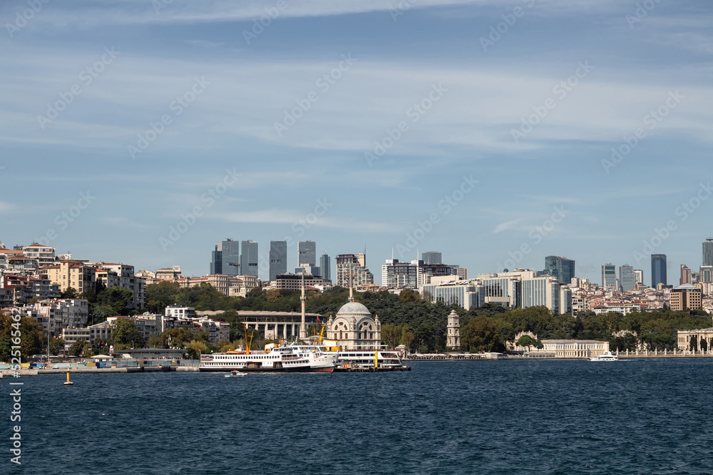 Fototapeta premium View of ferry boats, historical mosque and European side of Istanbul. It is a sunny summer day.