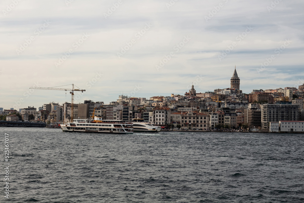 View of ferry boats on Golden Horn part of Bosphorus and Beyoglu district on European side of Istanbul. Galata tower is also in the view. Beautiful scene.