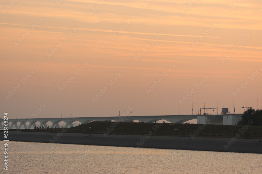 The 5022 meter bridge in south of the Netherlands at sunset