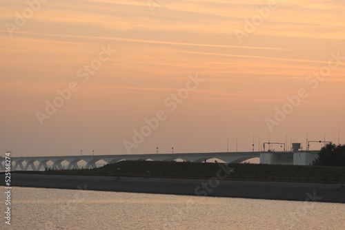 The 5022 meter bridge in south of the Netherlands at sunset © caroline