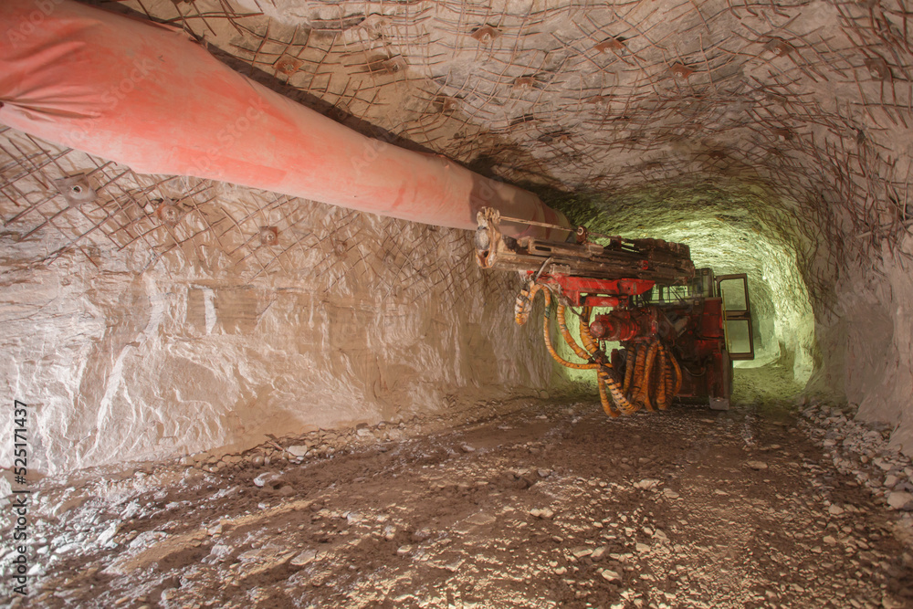 Obraz premium Drilling machine in deep salt mine.