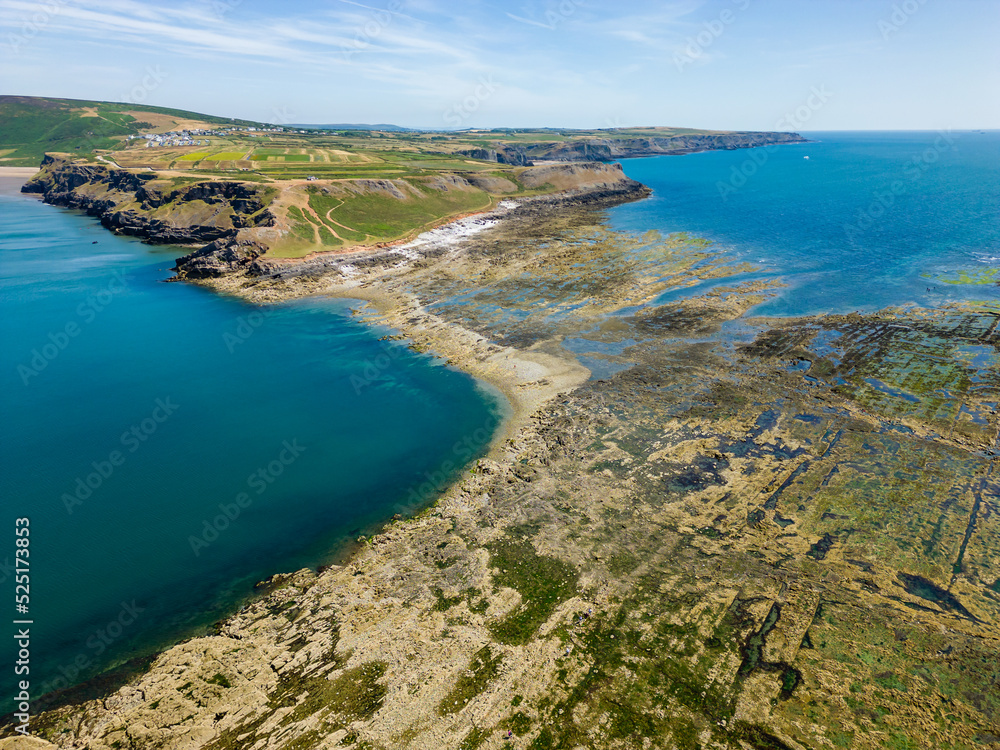 Aerial view of a causeway connecting the mainland to an island at low tide (Worm's Head, Wales) Aerial view of a causeway connecting the mainland to an island at low tide (Worm's Head, Wales)