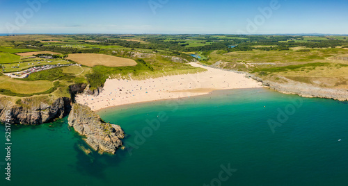 Panoramic aerial view of a beautiful sandy beach and rocky coastline (Broad Haven South, Wales) photo