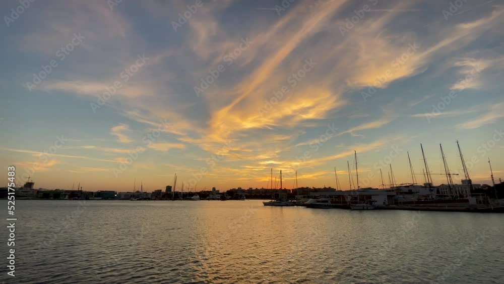 (SlowMotion 60fps to 24fps) Jetty at sunset of the marina in Valencia, Spain. (SlowMotion 60fps to 24fps) Jetty at sunset of the marina in Valencia, Spain.