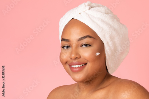 Black Woman Posing With Moisturizer Dots On Face, Pink Background