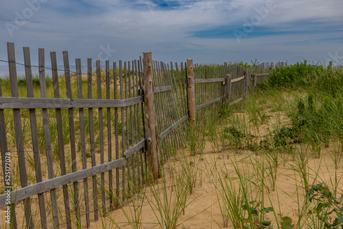 Wooden Fence In The Sand Dunes In The Summer At The Cape Cod Beach, Massachusetts photo