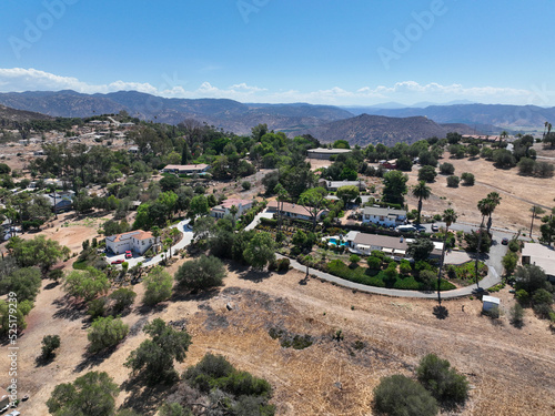 Aerial view of dry valley and land with houses and barn in Escondido  San Diego  California