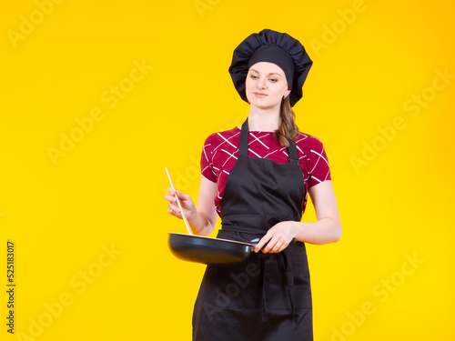 Chef woman. Cook with fryin...