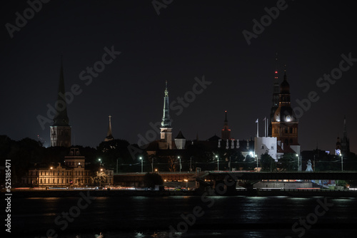 Panorama of the night Riga, Latvia. Panoramic view of city Riga with a St. Peters Church in foreground. Long exposure night photography