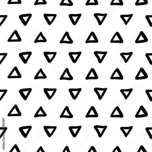 Simple hand drawn geometric pattern. Abstract spots, dashes, polka dots, triangles in black and white. Trendy monochrome brush marks. Ornament in grunge style