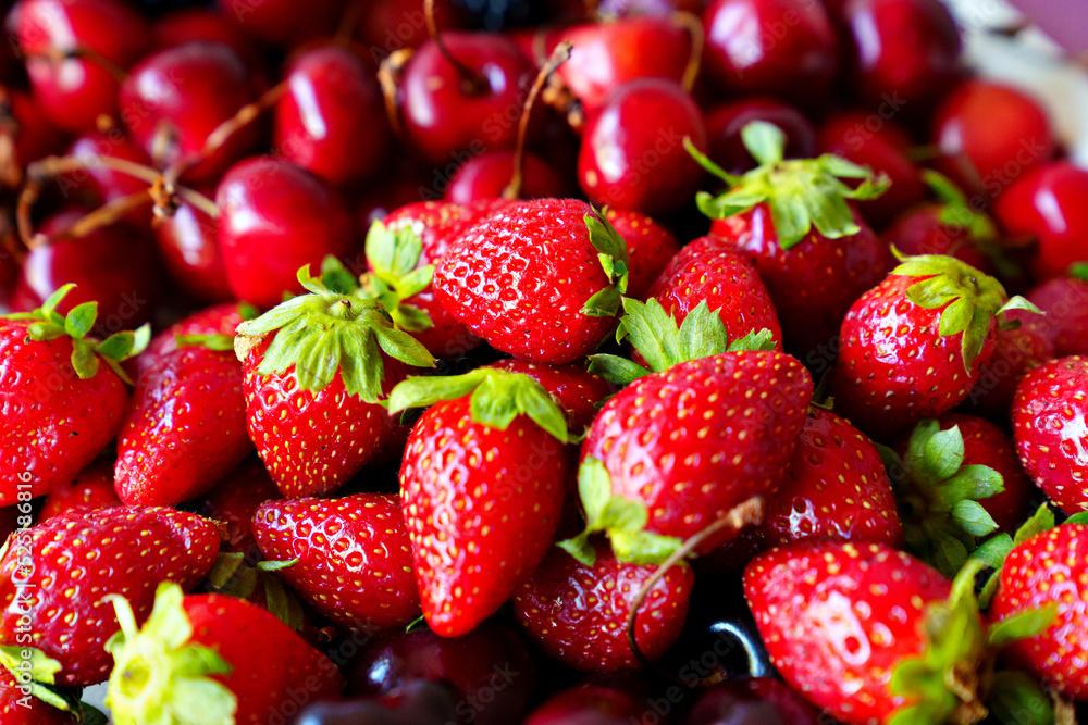 strawberries and cherries. healthy and delicious dessert. strawberries and cherries. healthy and delicious dessert.