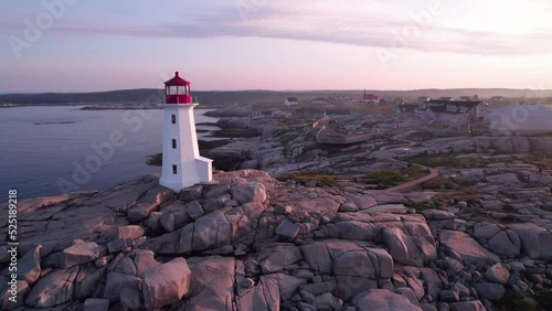 Peggy's Cove Lighthouse in Nova Scotia Canada at Sunrise - Aerial Drone Footage