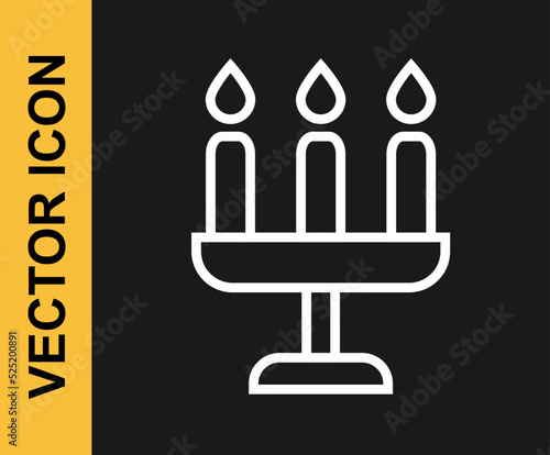 White line Candelabrum with three candlesticks icon isolated on black background. Vector