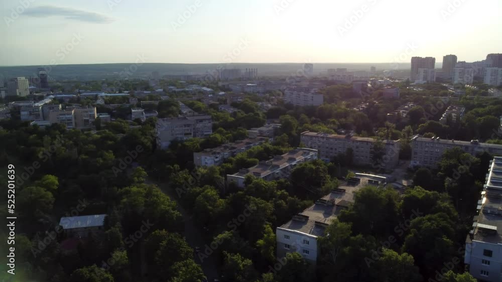 Aerial sunset panoramic view on green summer Kharkiv city and popular recreation park Sarzhyn Yar. Botanical garden in residential area in sunlight Aerial sunset panoramic view on green summer Kharkiv city and popular recreation park Sarzhyn Yar. Botanical garden in residential area in sunlight