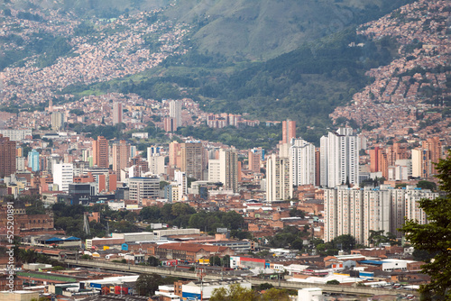 Skyline of a city with buildings and houses built next to a mountain. Medellin Colombia.