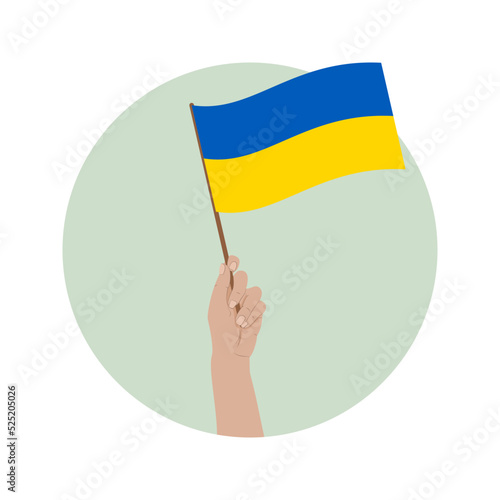 Uniesiona ręka z flagą Ukrainy na zielonym tle. Wsparcie dla Ukrainy. "Nie" dla wojny. Nadzieja i modlitwa o pokój.