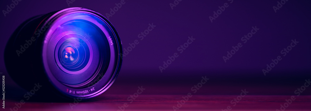 camera lens with lens reflections on purple background camera lens with lens reflections on purple background