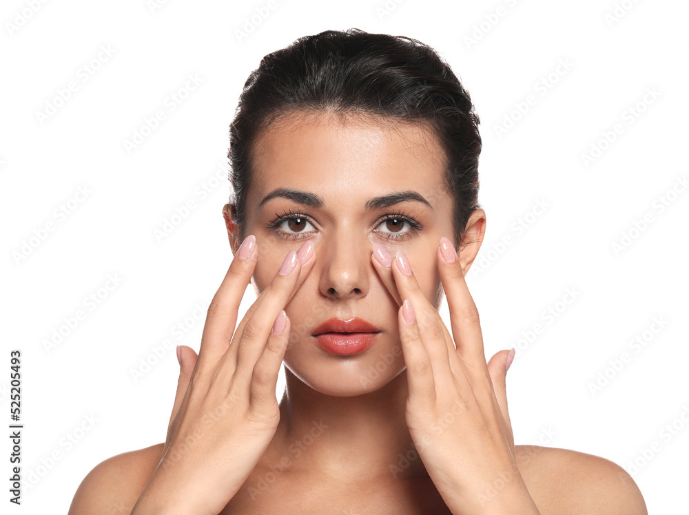 Woman applying cream under eyes on white background. Skin care Woman applying cream under eyes on white background. Skin care