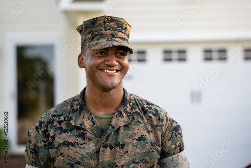 Vászonkép Marine service member arrives home in his car and walks into his house