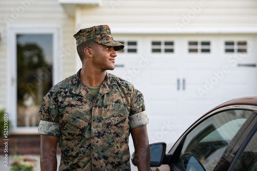 Canvas Print Marine service member arrives home in his car and walks into his house