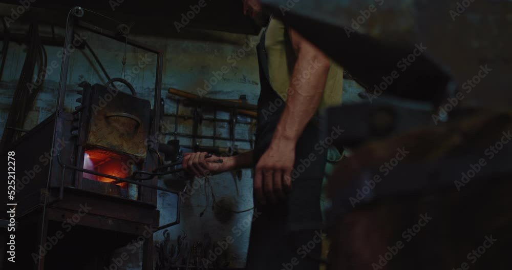 handmade metalworking, blacksmith is hammering red hot metallic detail in anvil, closeup, 4K, Prores handmade metalworking, blacksmith is hammering red hot metallic detail in anvil, closeup, 4K, Prores