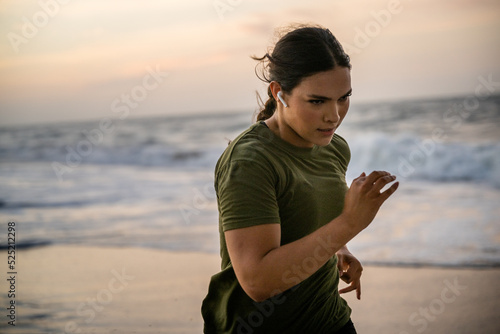 Marine veteran trains every morning on the beach to stay in shape just like when she was on active duty.