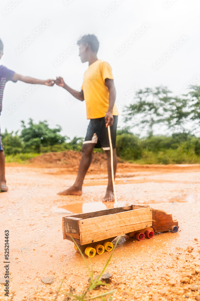 Indigenous children greeting each other while playing with a wooden truck in the caribbean of Nicaragua, Central America Indigenous children greeting each other while playing with a wooden truck in the caribbean of Nicaragua, Central America