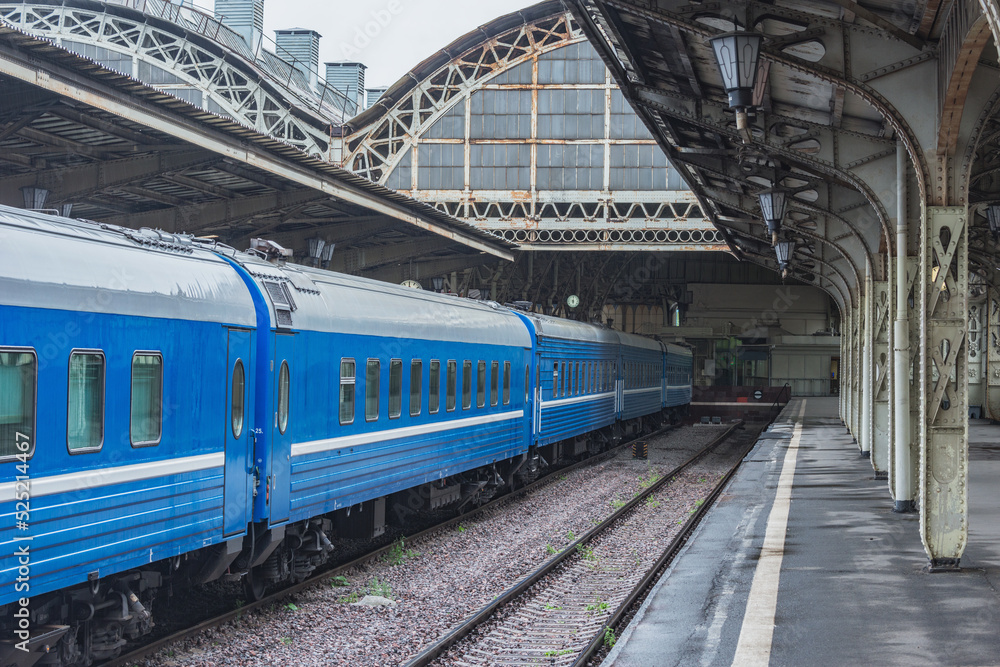 Fototapeta premium Train stands by the platform.