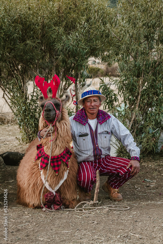 indigenous in the middle of the mountains of guatemala with llama and traditional costume