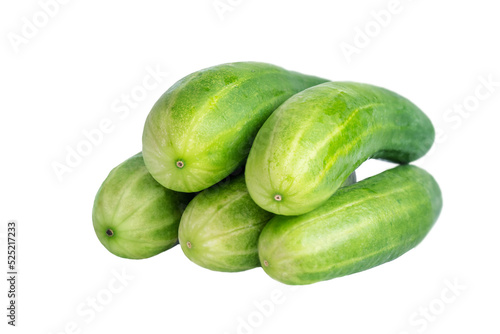 Several cucumbers lie on top of each other isolated