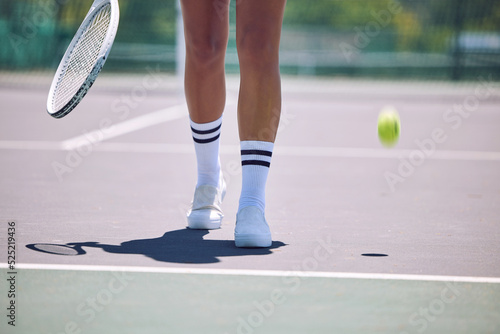 Fitness, tennis and sports legs of woman with racket and ball walking on court after serving in training, workout or exercise. Sporty shoes, active or healthy player losing match, game or competition