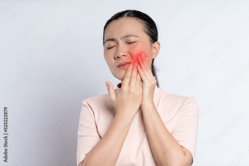 Asian woman was sick with toothache standing isolated on white background. Asian woman was sick with toothache standing isolated on white background.