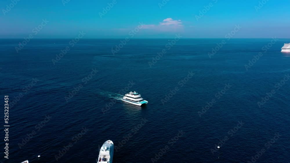 Aerial view drone flying around the Catalina express coming into the harbor of Avalon on Catalina Island. Aerial view drone flying around the Catalina express coming into the harbor of Avalon on Catalina Island.