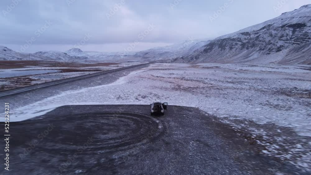 Couple alone in the middle of nowhere on a car park, Iceland. Winter TIme Couple alone in the middle of nowhere on a car park, Iceland. Winter TIme