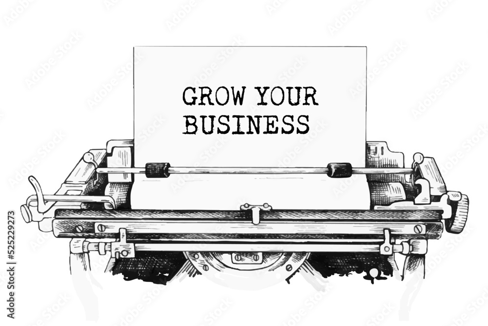 Text 'GROW YOUR BUSINESS' typed on retro typewriter.