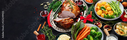 Fotografie Traditional Christmas dinner on dark background.