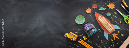 education. Back to school concept over blackboard background. top view, flat lay photo