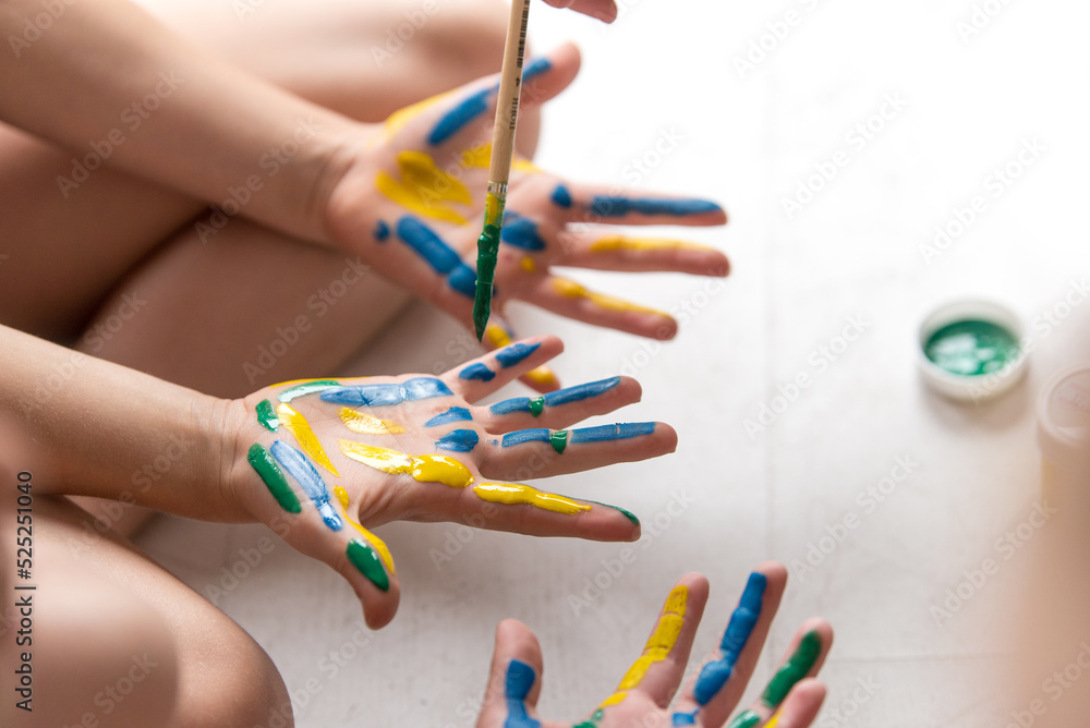 Hands of a child in paint. kids hands covered with paint top view ...