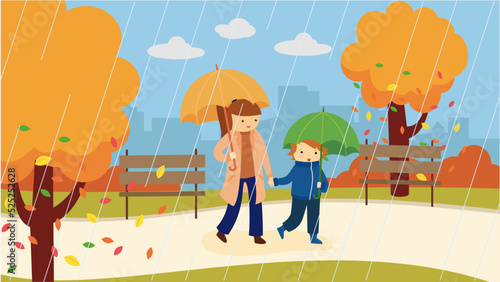 mother and son walk under umbrellas in the rain