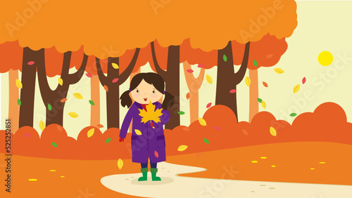 girl picking up fallen leaves
