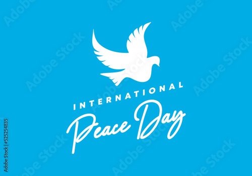 International peace day background on September 21 with pigeon on blue background.