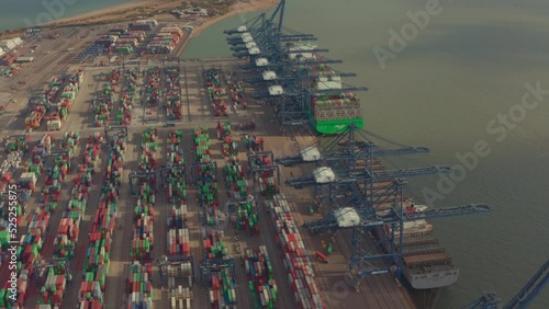Low aerial shot over Container yard and loading cranes at port of felixstowe photo