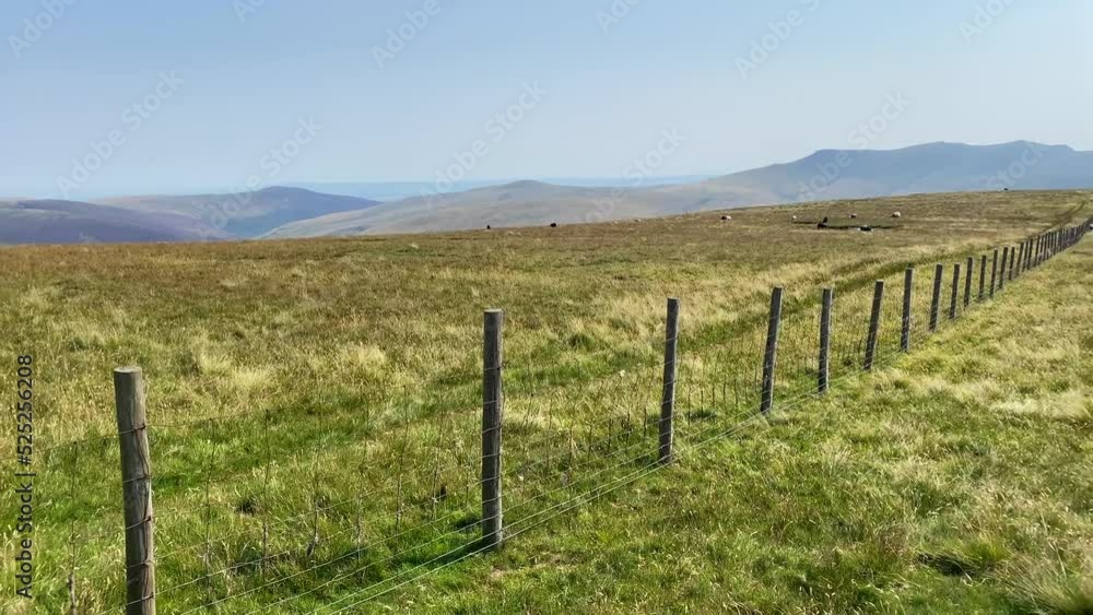 Green fields and hills in nature of Lake District in Cumbria, England Green fields and hills in nature of Lake District in Cumbria, England